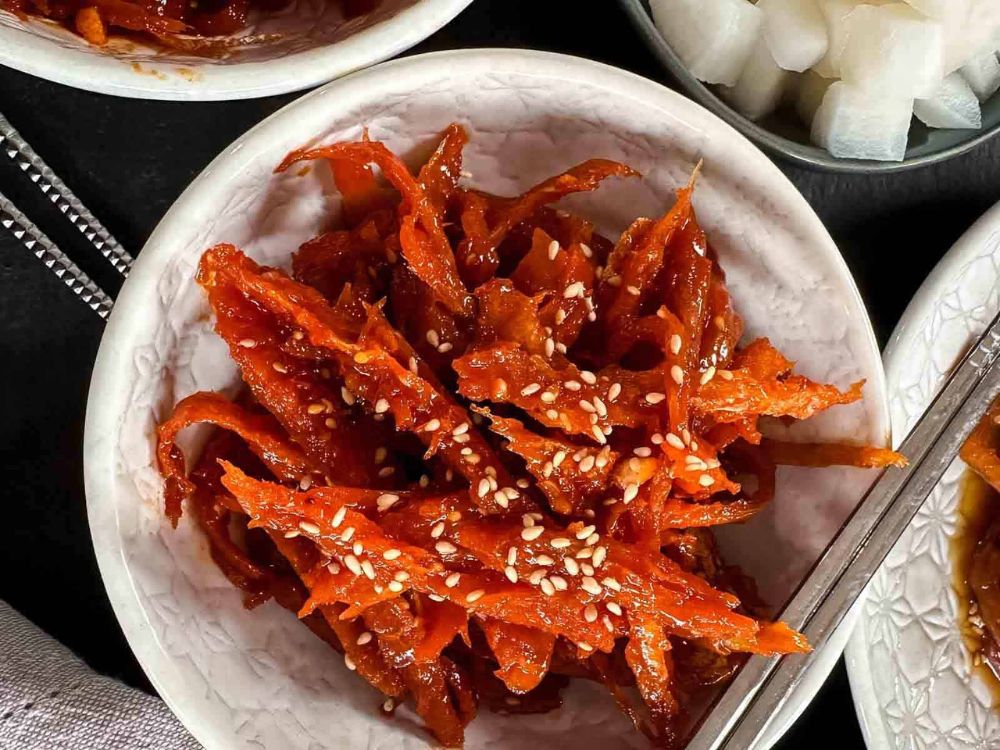 Steaming bowl of Korean doenjang jjigae with tofu and vegetables, a classic comfort dish served at the Best Korean Restaurants.
